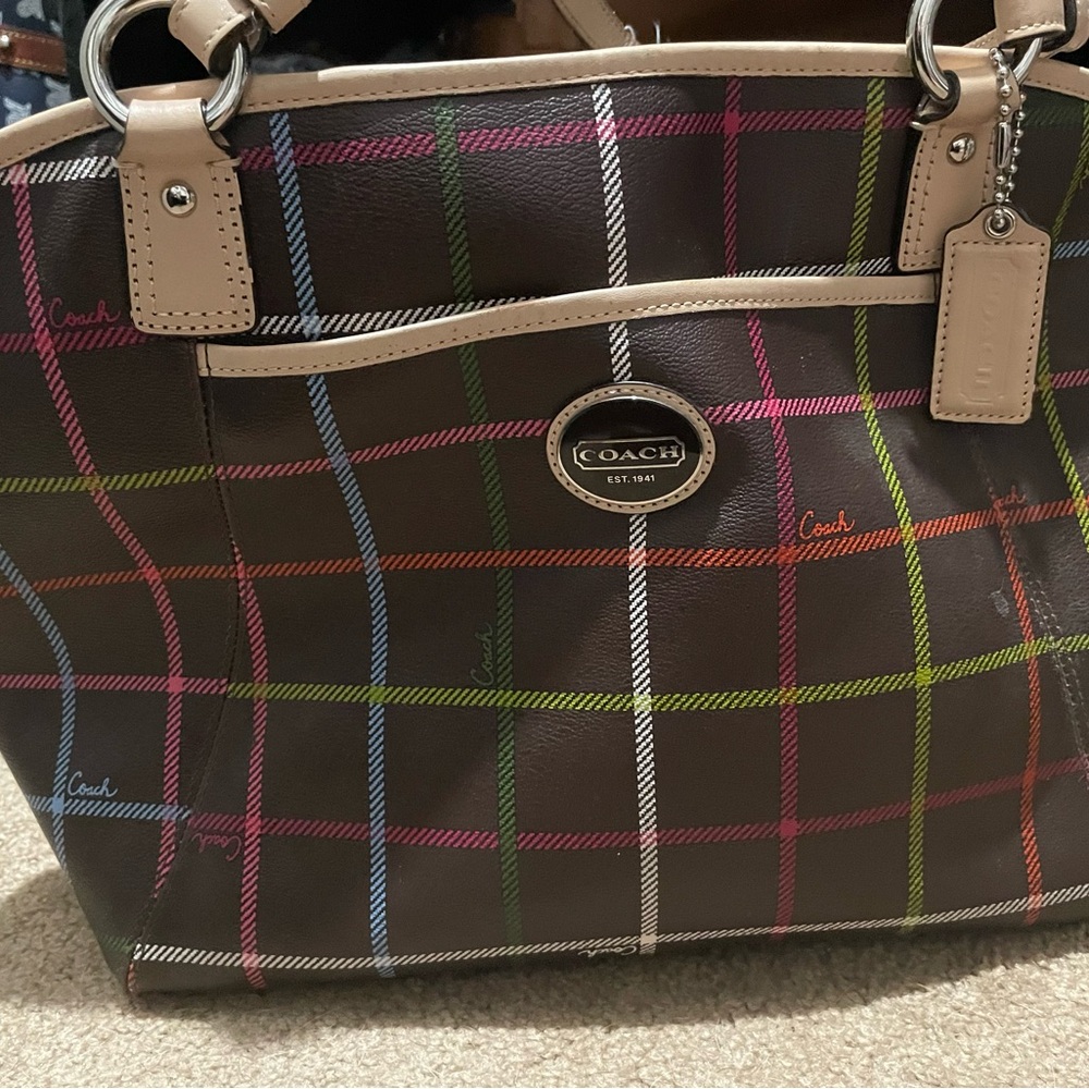 Brown and multi colored coach bag.